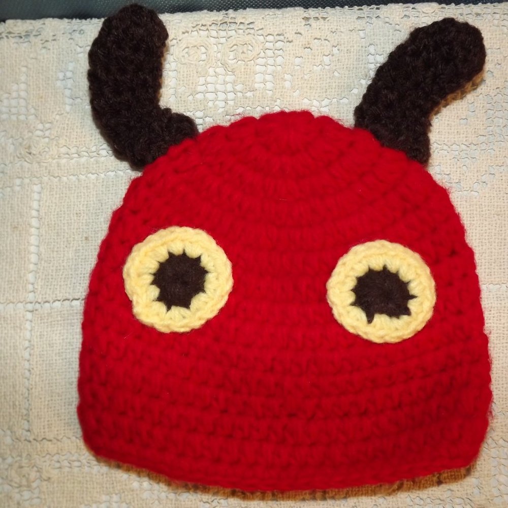 Hand crafted knitted baby hat hungry hungry caterpillar